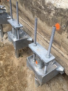 Underpinning foundation with helical piles - The Glebe   